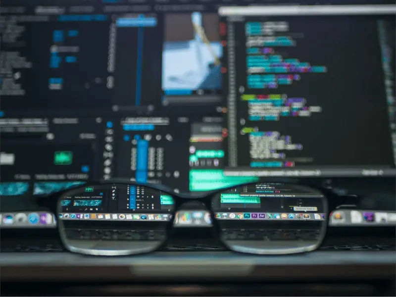 blurry-laptop-with-a-focused-view-through-a-set-of-glasses